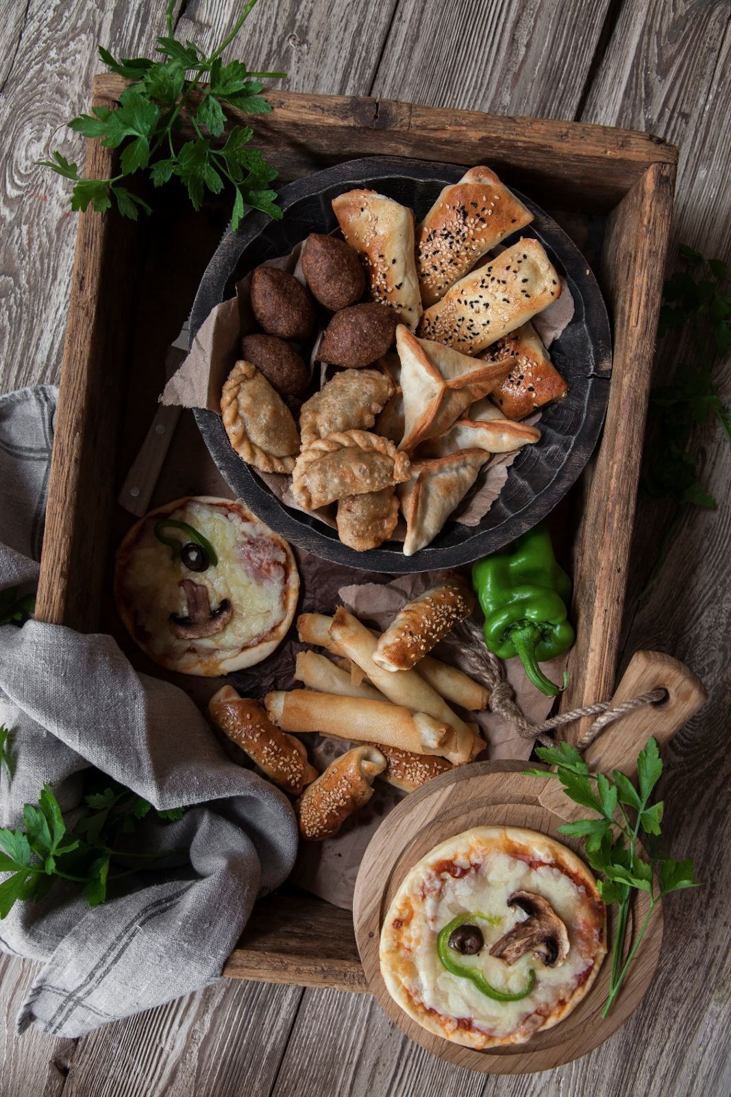 Mezze tray of kibbeh, sambousek and mini pizzas