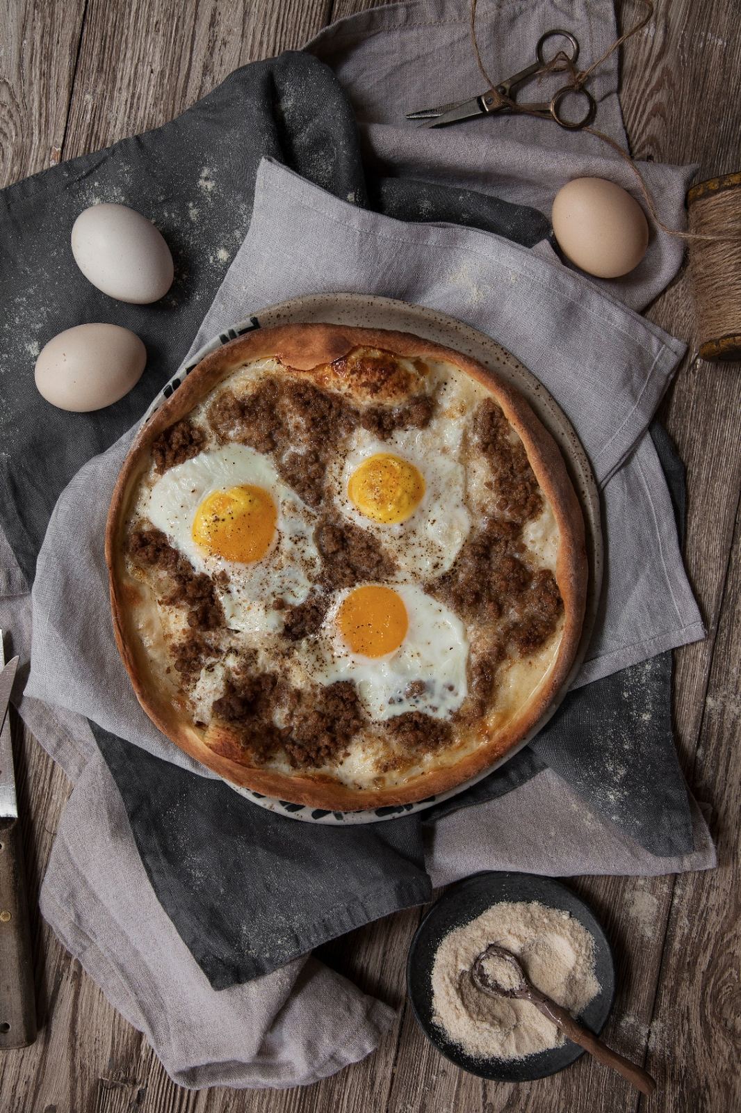 Breakfast pie with minced meat and eggs